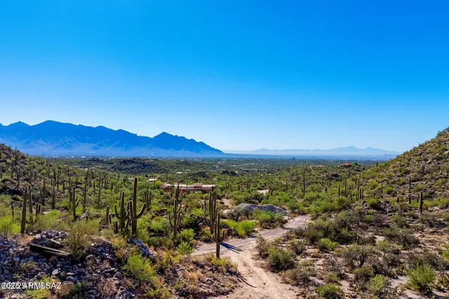 a view of a city with mountains in the background