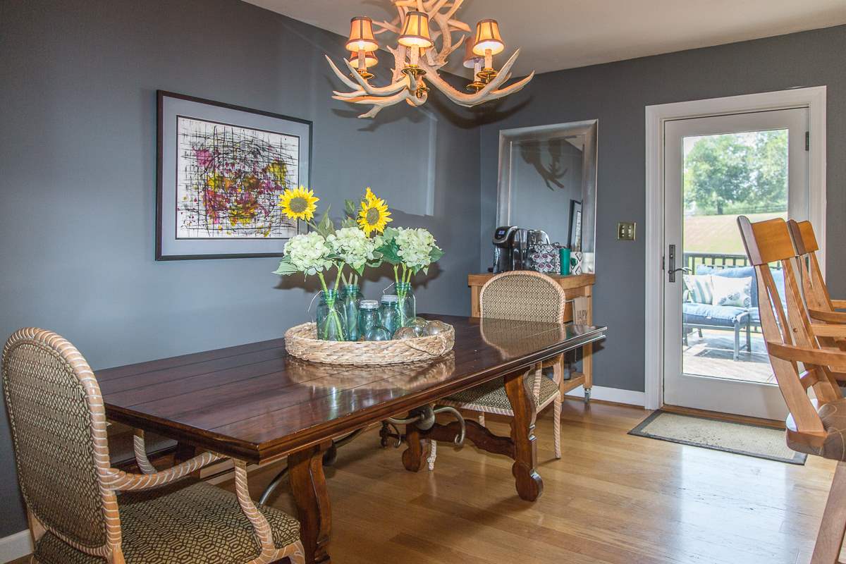5720 Battlefield Road Harrisonburg, VA 22801 - Photo 15 of 41 a dining room filled chandelier and wooden floor