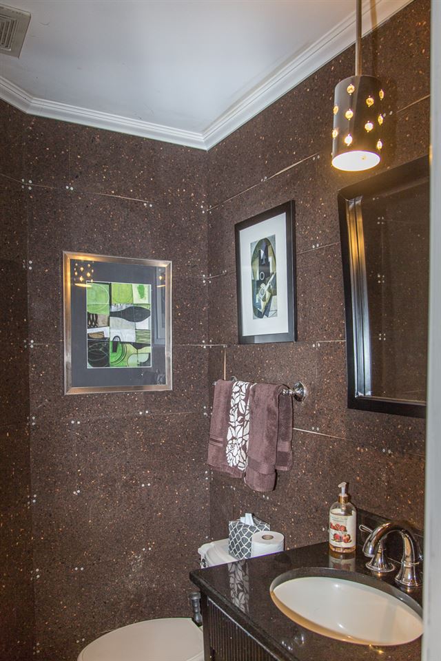 5720 Battlefield Road Harrisonburg, VA 22801 - Photo 23 of 41 a bathroom with a toilet a sink and mirror