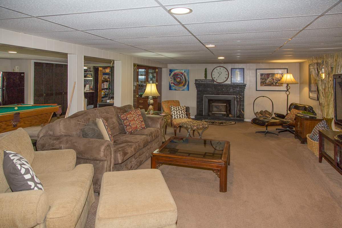 5720 Battlefield Road Harrisonburg, VA 22801 - Photo 28 of 41 a living room with furniture a fireplace and a flat screen tv