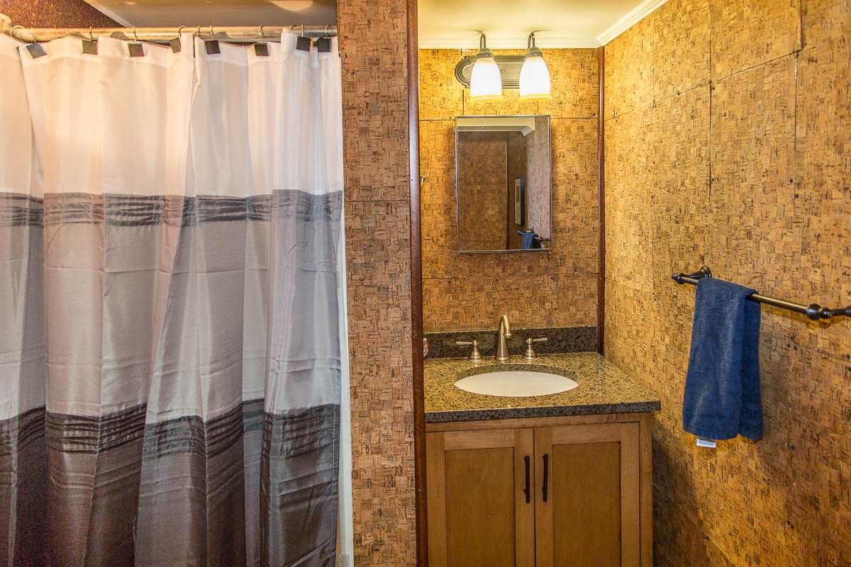5720 Battlefield Road Harrisonburg, VA 22801 - Photo 29 of 41 a bathroom with a sink a mirror and a shower curtain