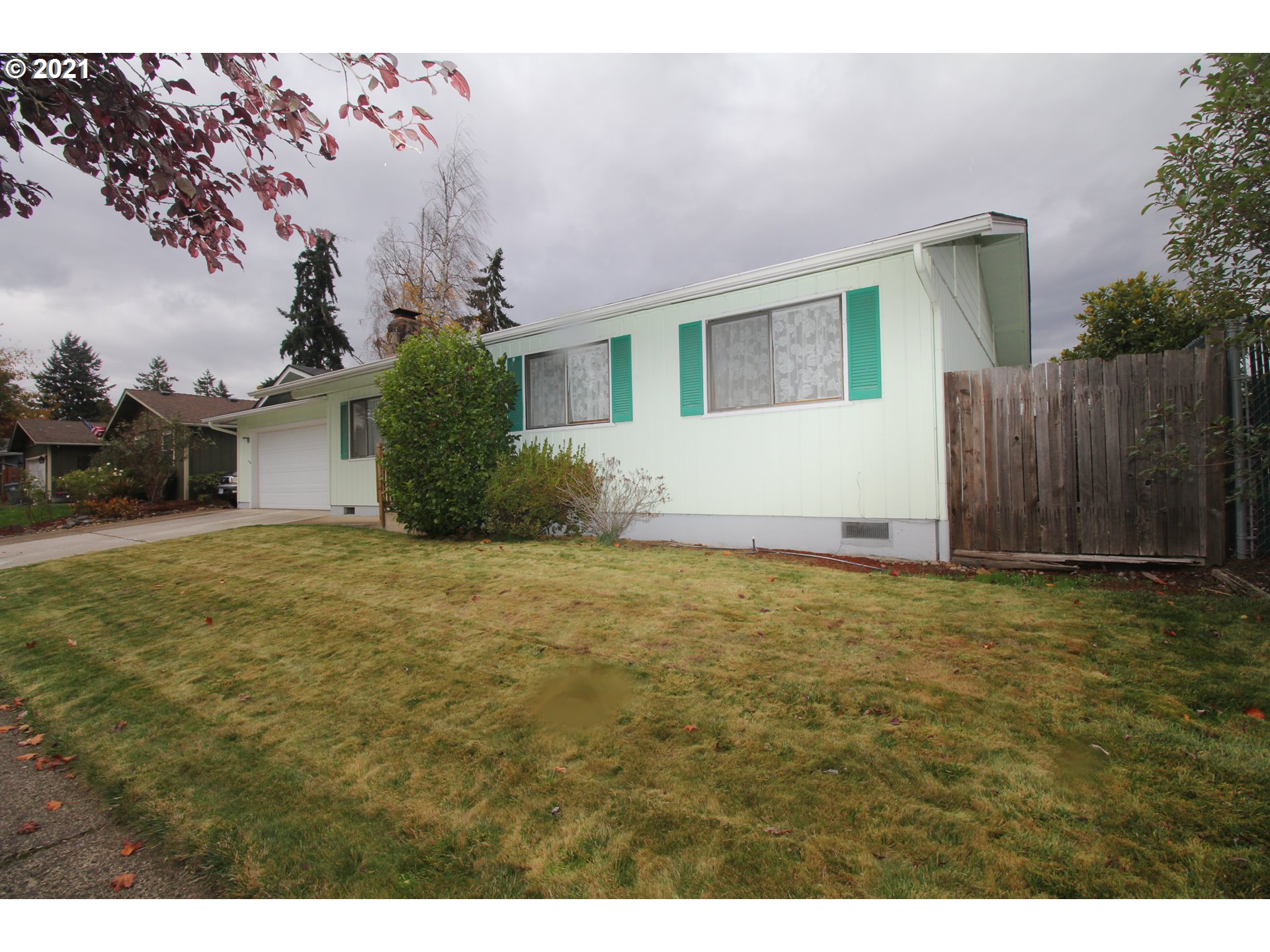 6988 B Street Springfield, OR 97478 - Photo 2 of 31 a view of an house with backyard and garden