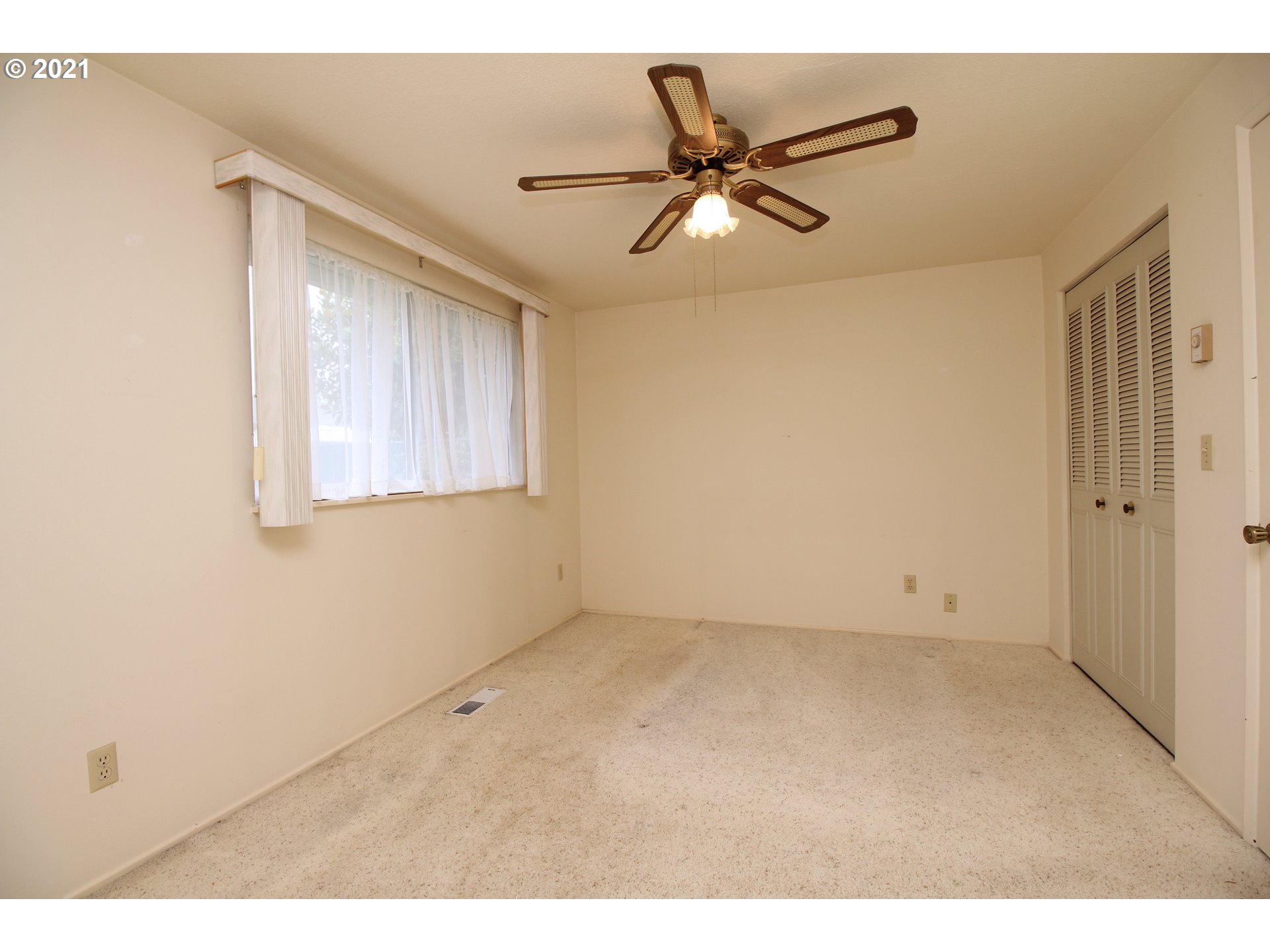 6988 B Street Springfield, OR 97478 - Photo 18 of 31 a view of an empty room with a window