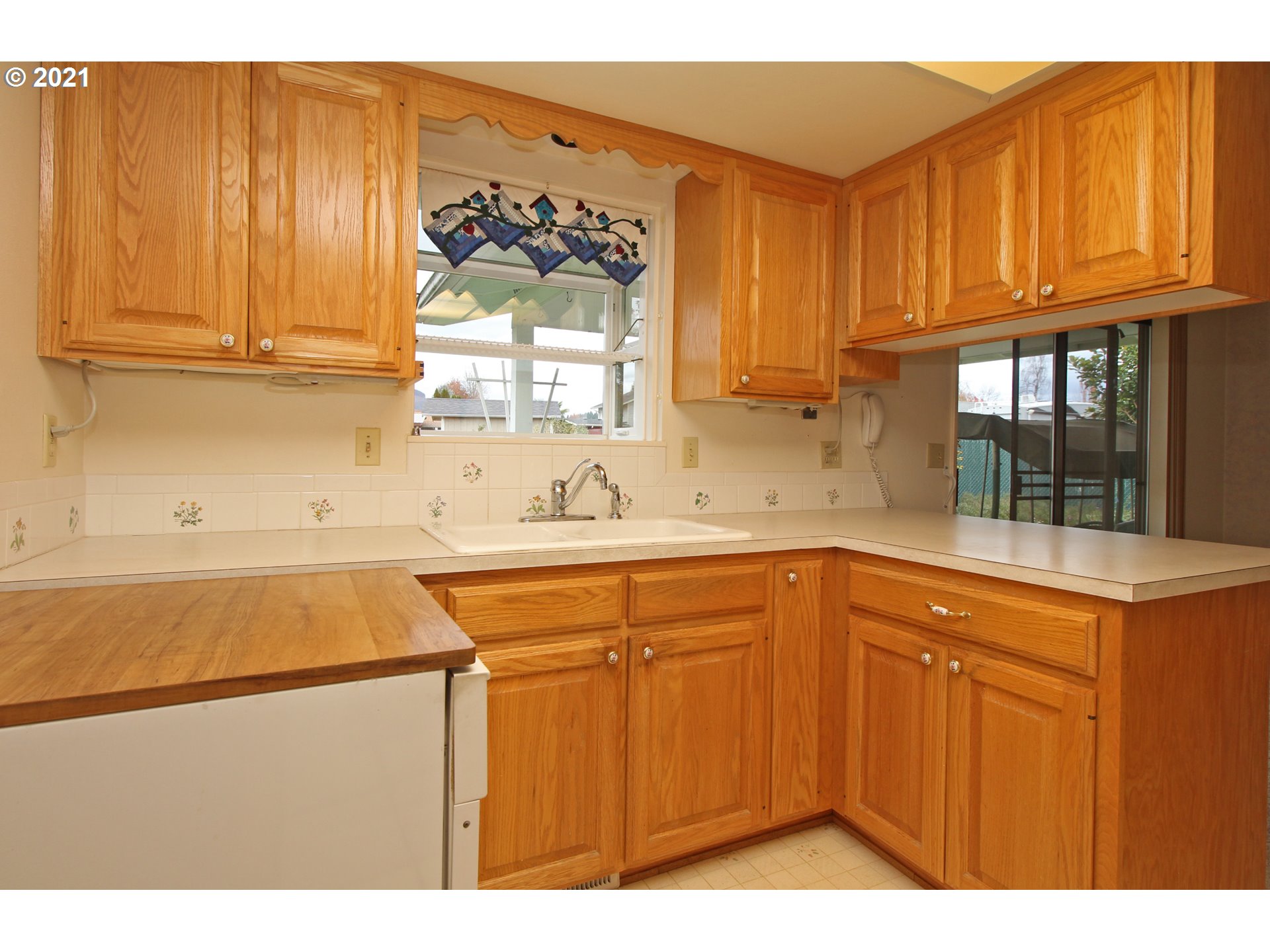 6988 B Street Springfield, OR 97478 - Photo 8 of 31 a kitchen with a sink and cabinets