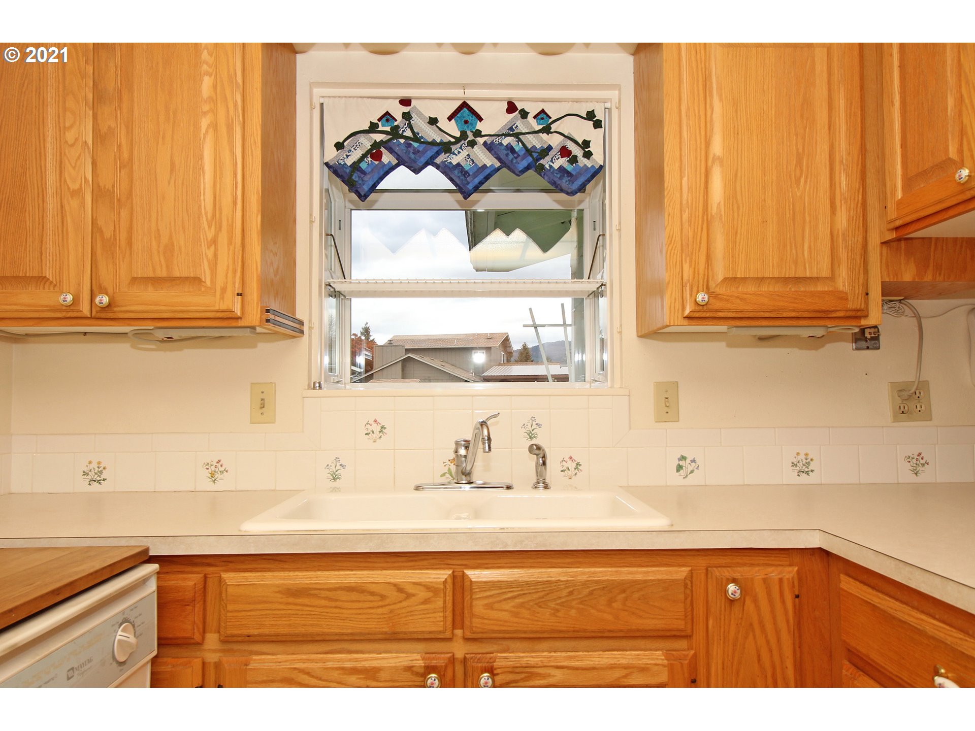 6988 B Street Springfield, OR 97478 - Photo 9 of 31 a kitchen with a sink and cabinets