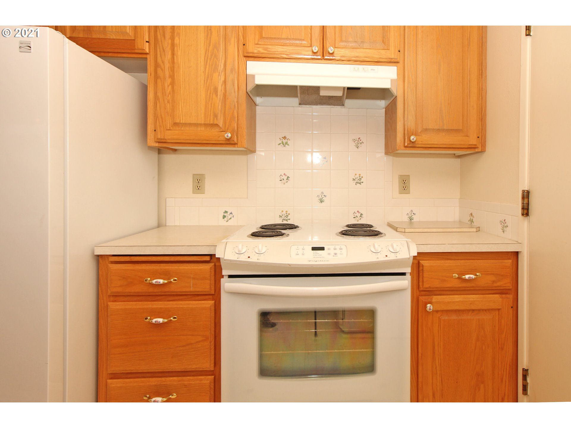 6988 B Street Springfield, OR 97478 - Photo 10 of 31 a kitchen with stainless steel appliances granite countertop a sink and cabinets