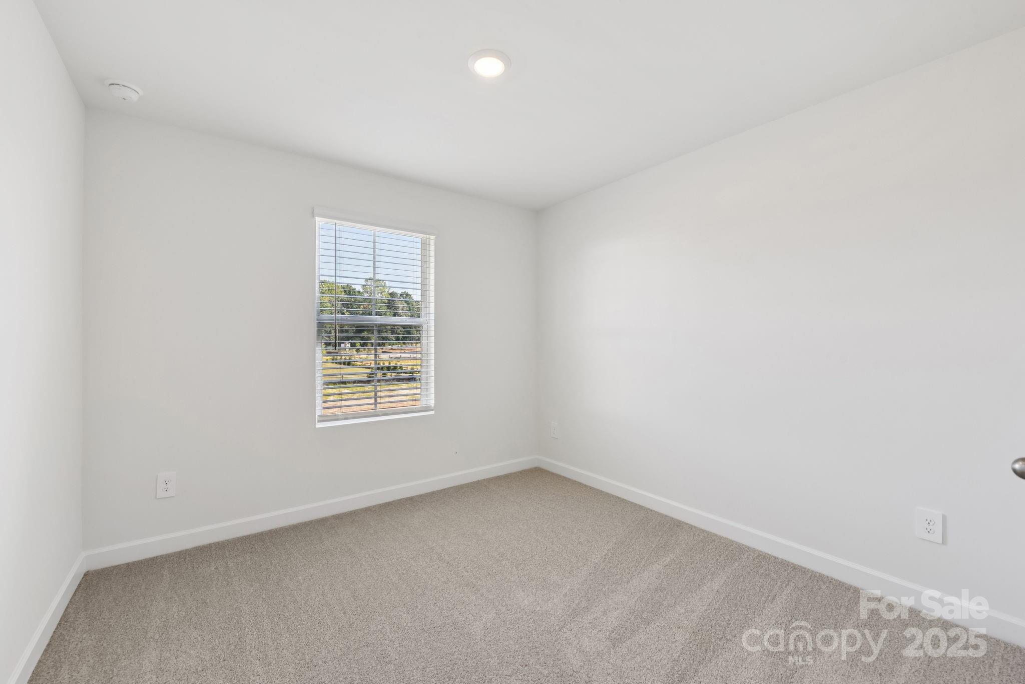 278 Tiger Lily Drive Fort Mill, SC 29708 - Photo 12 of 18 an empty room with a window