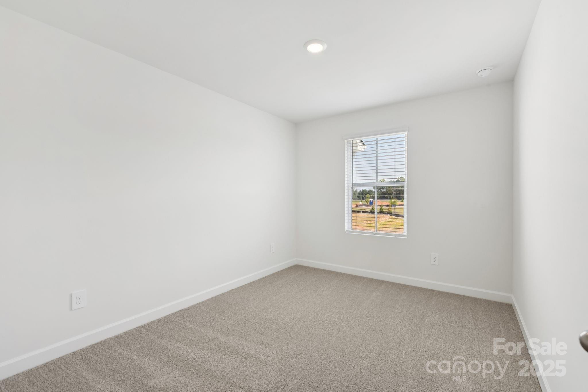 278 Tiger Lily Drive Fort Mill, SC 29708 - Photo 9 of 18 an empty room with a window