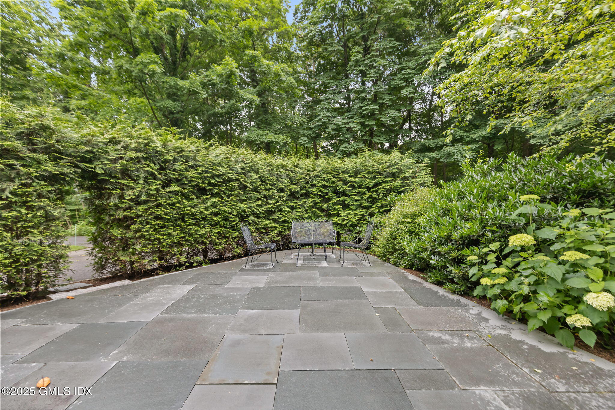 90 Brookside Drive Greenwich, CT 06831 - Photo 27 of 39 a view of a yard with plants and large trees