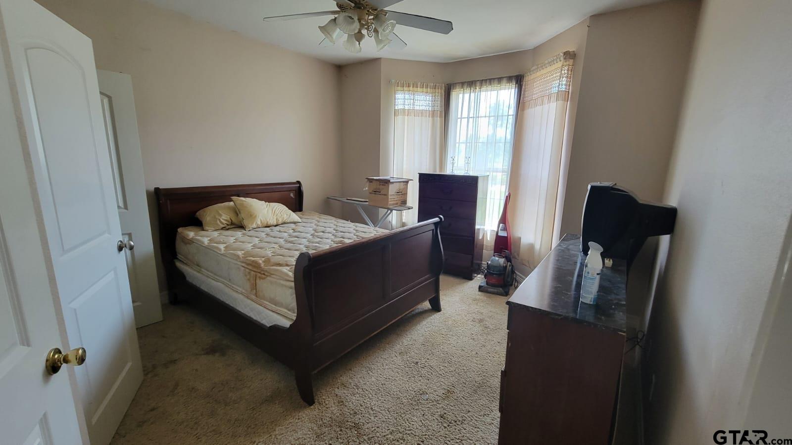 100 Thames Drive Bullard, TX 75757 - Photo 14 of 32 a bedroom with a bed and wooden floor