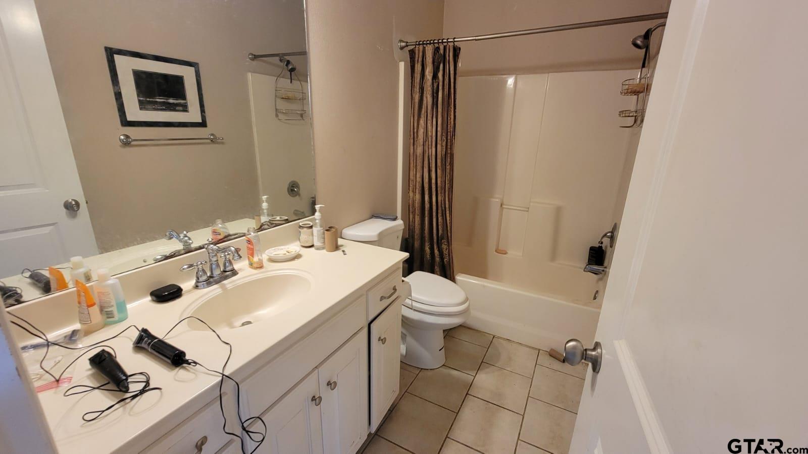 100 Thames Drive Bullard, TX 75757 - Photo 16 of 32 a bathroom with a sink mirror vanity and toilet
