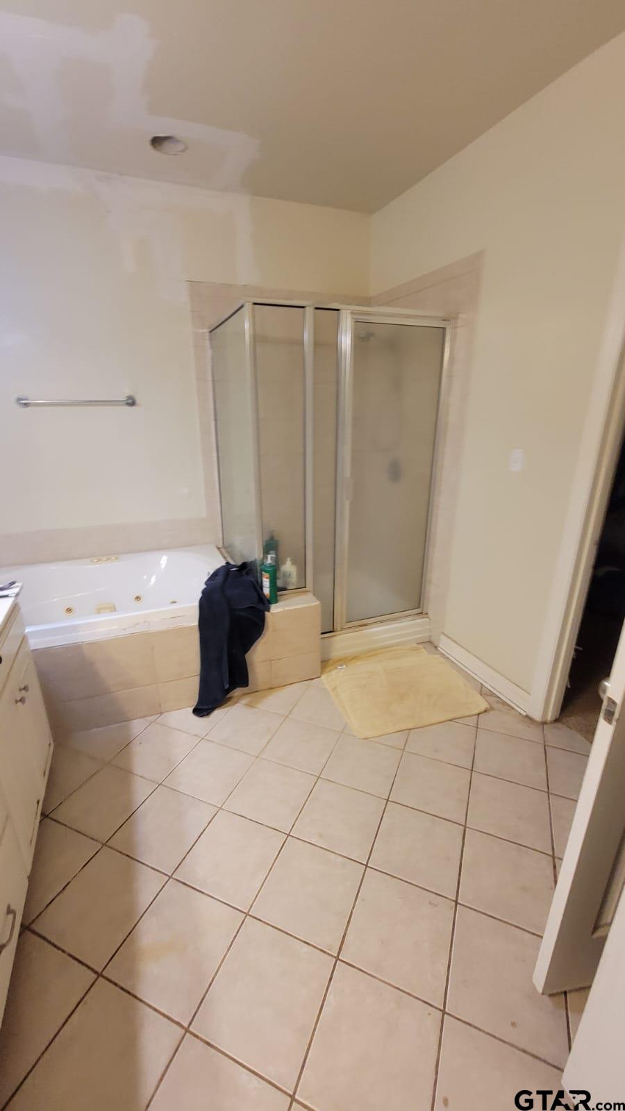 100 Thames Drive Bullard, TX 75757 - Photo 24 of 32 a bedroom with a bed and a shower