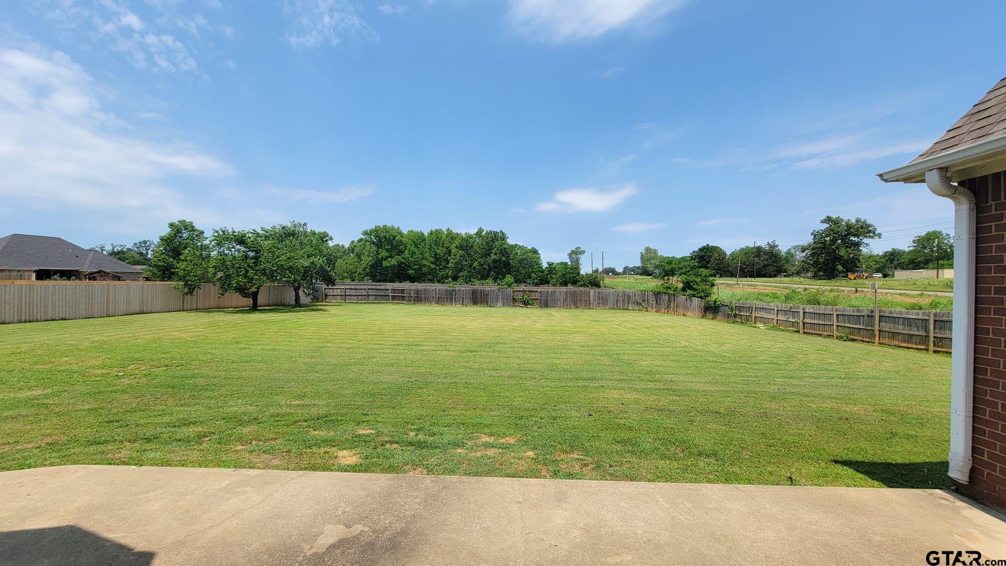 100 Thames Drive Bullard, TX 75757 - Photo 29 of 32 a view of a lake with a big yard