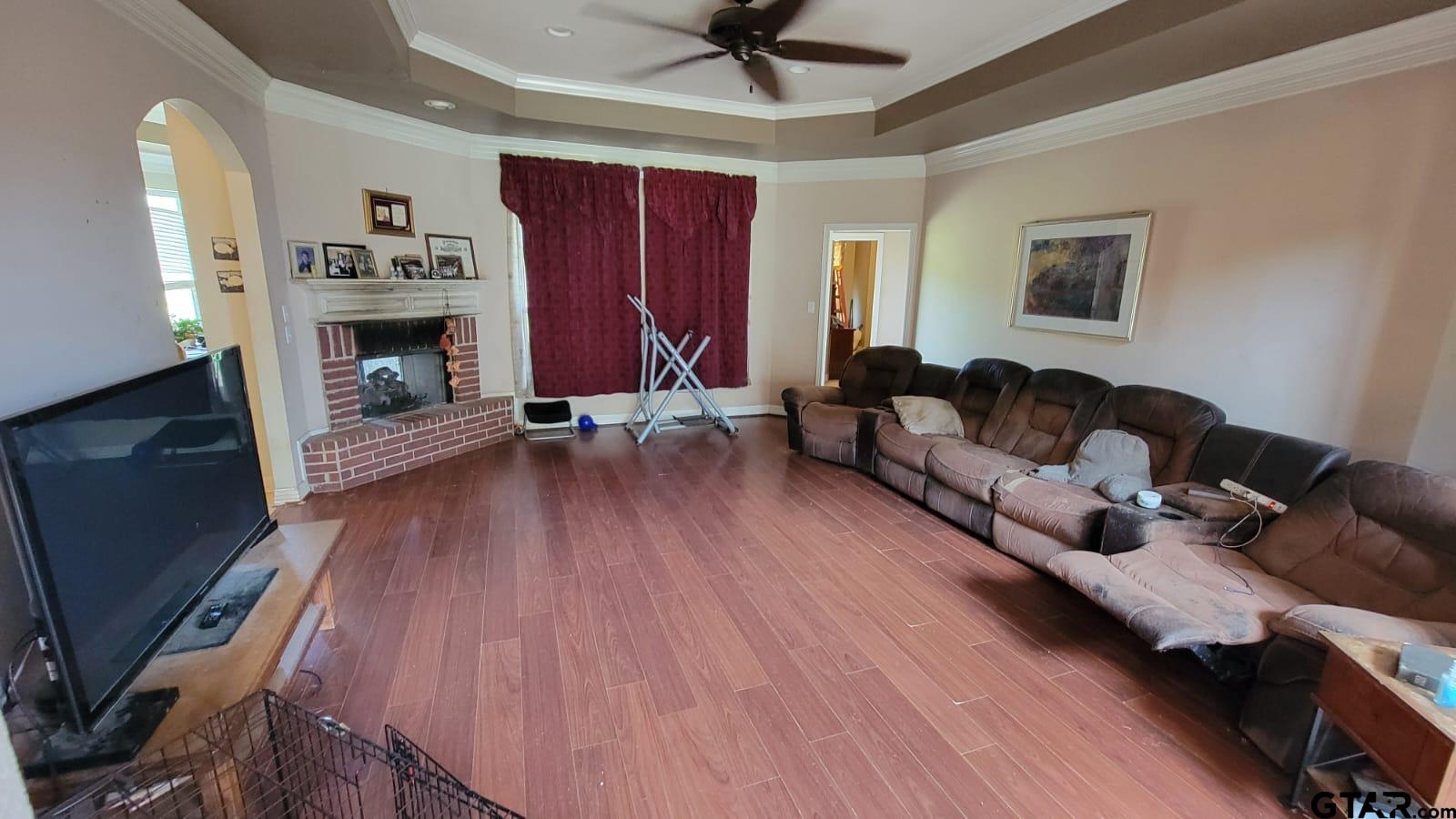 100 Thames Drive Bullard, TX 75757 - Photo 4 of 32 a living room with furniture and a fireplace