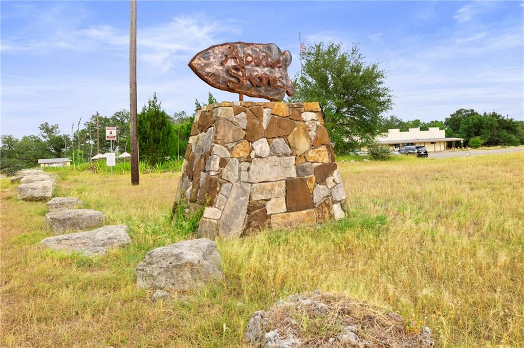 2610 Geronimo Trail Austin, TX 78734 - Photo 6 of 8 a building with trees in front of it