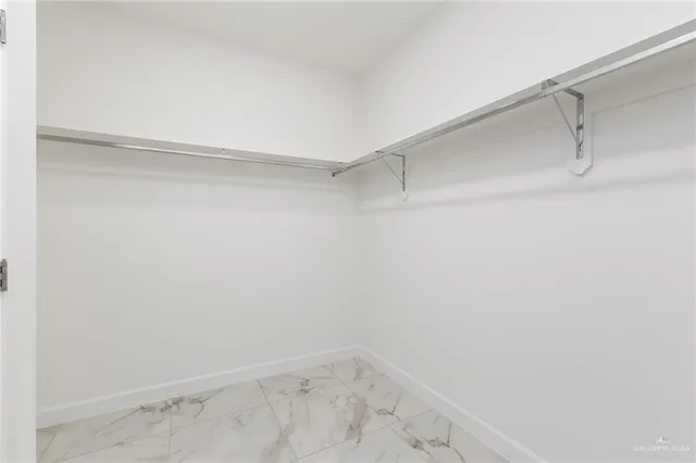 a view of an empty walk in closet