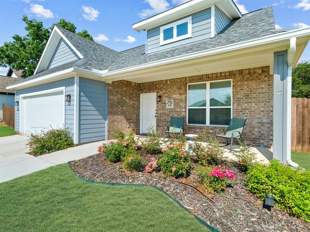 608 Porcupine Drive Springtown, TX 76082 - Photo 21 of 37 a front view of a house with a yard