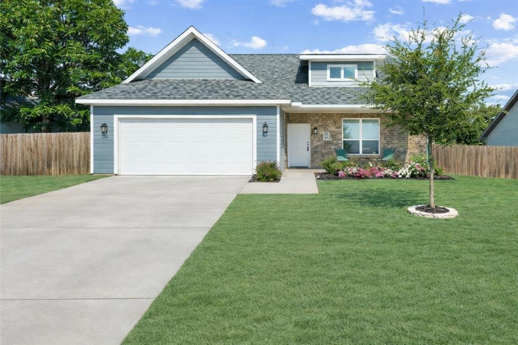 608 Porcupine Drive Springtown, TX 76082 - Photo 29 of 37 a view of a house with a yard and potted plants