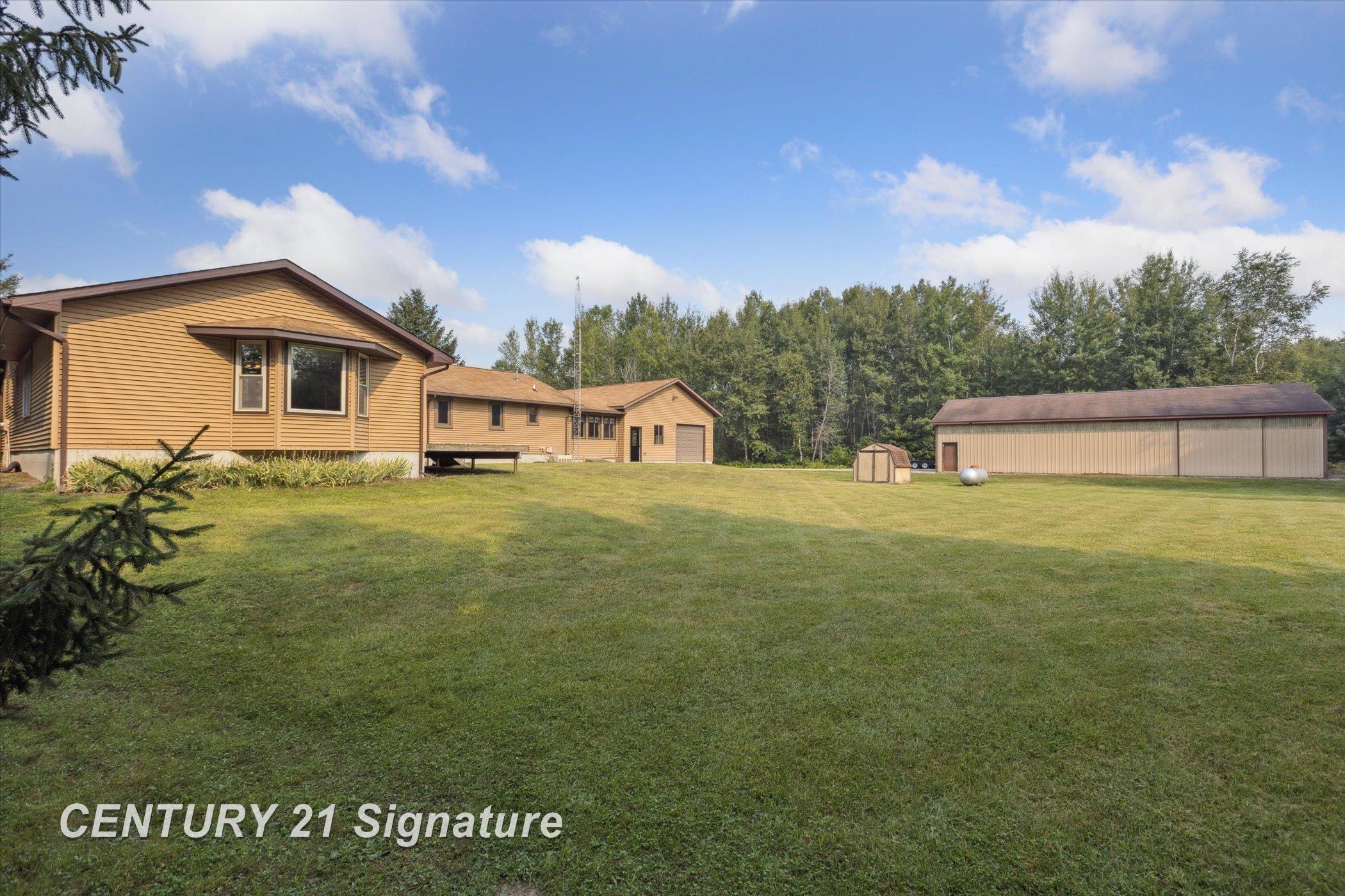 132 North 9 Mile Road Midland, MI 48640 - Photo 62 of 84 Back view of the house