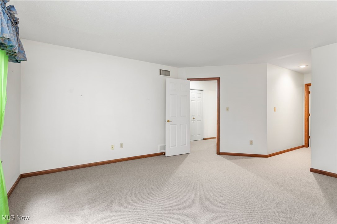 2155 Abbey Road Akron, OH 44312 - Photo 17 of 31 Unfurnished room featuring light colored carpet and baseboards