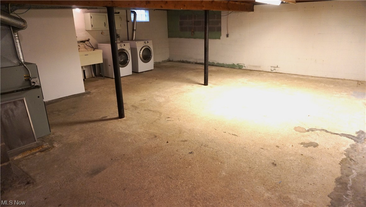 12289 Webster Road Strongsville, OH 44136 - Photo 15 of 19 Basement featuring washing machine and clothes dryer