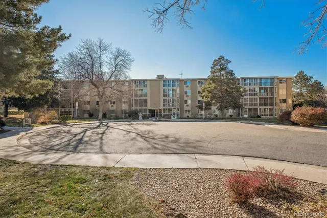 a view of a building with a garden