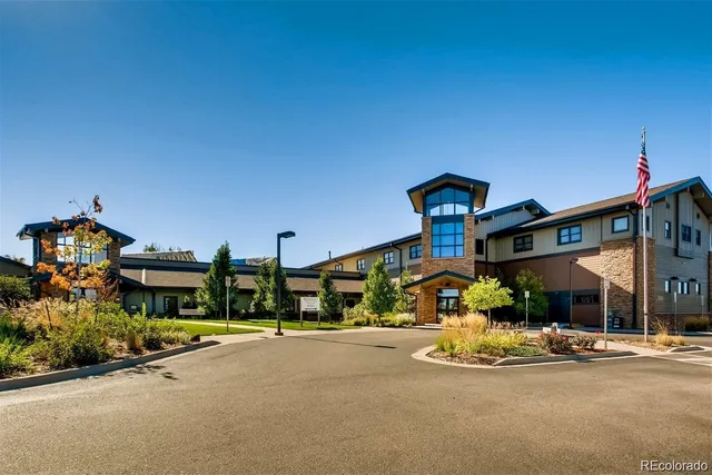 a view of a swimming pool with outdoor seating