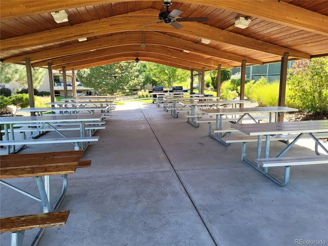 a room with lots of table and chairs