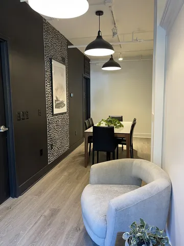 a living room with furniture a window and a table