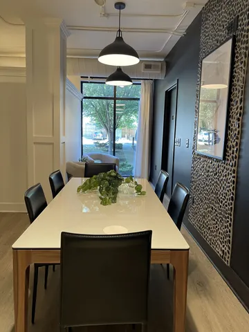 a view of a dining room with furniture window and outside view