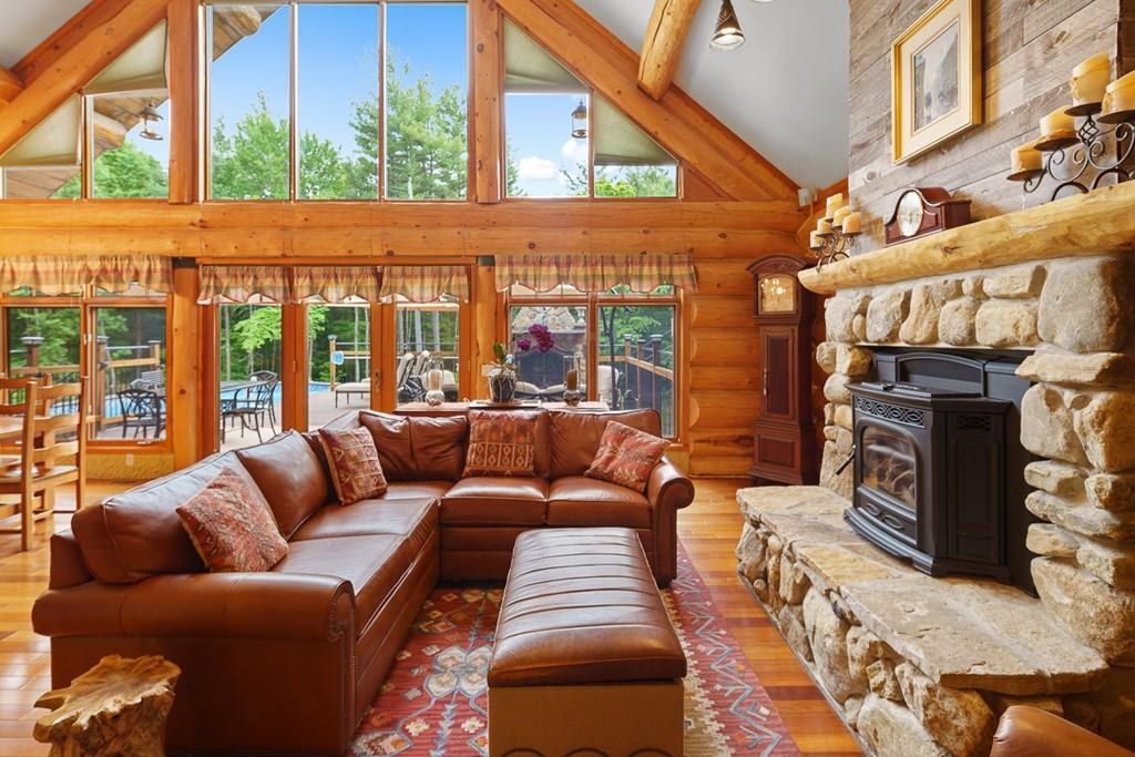 49 Beaman Road Princeton, MA 01541 - Photo 14 of 42 a view of a living room filled with furniture and a fireplace