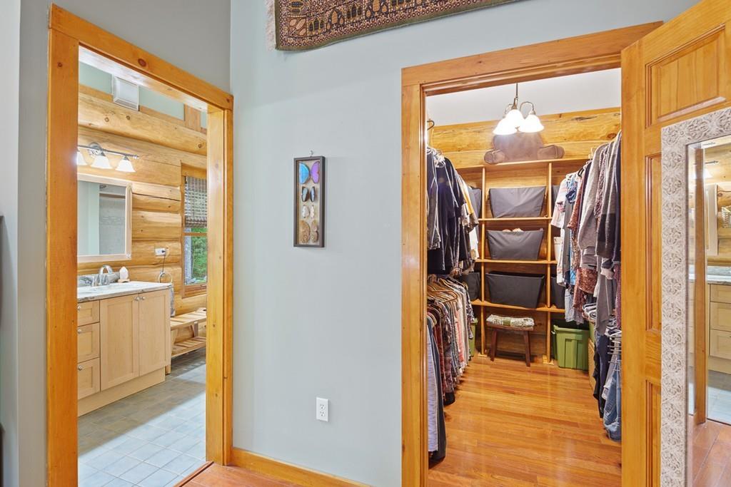 49 Beaman Road Princeton, MA 01541 - Photo 17 of 42 a view of a hallway with wooden floor and a living room