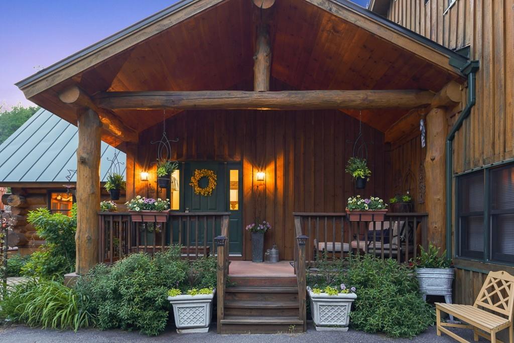 49 Beaman Road Princeton, MA 01541 - Photo 2 of 42 a front view of house with outdoor seating and plants