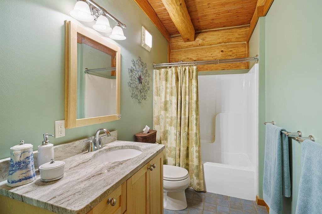 49 Beaman Road Princeton, MA 01541 - Photo 21 of 42 a bathroom with a granite countertop sink toilet and shower