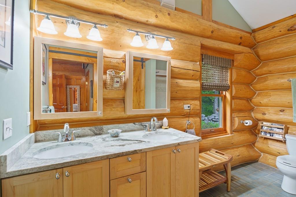49 Beaman Road Princeton, MA 01541 - Photo 22 of 42 a bathroom with a granite countertop sink and a large mirror