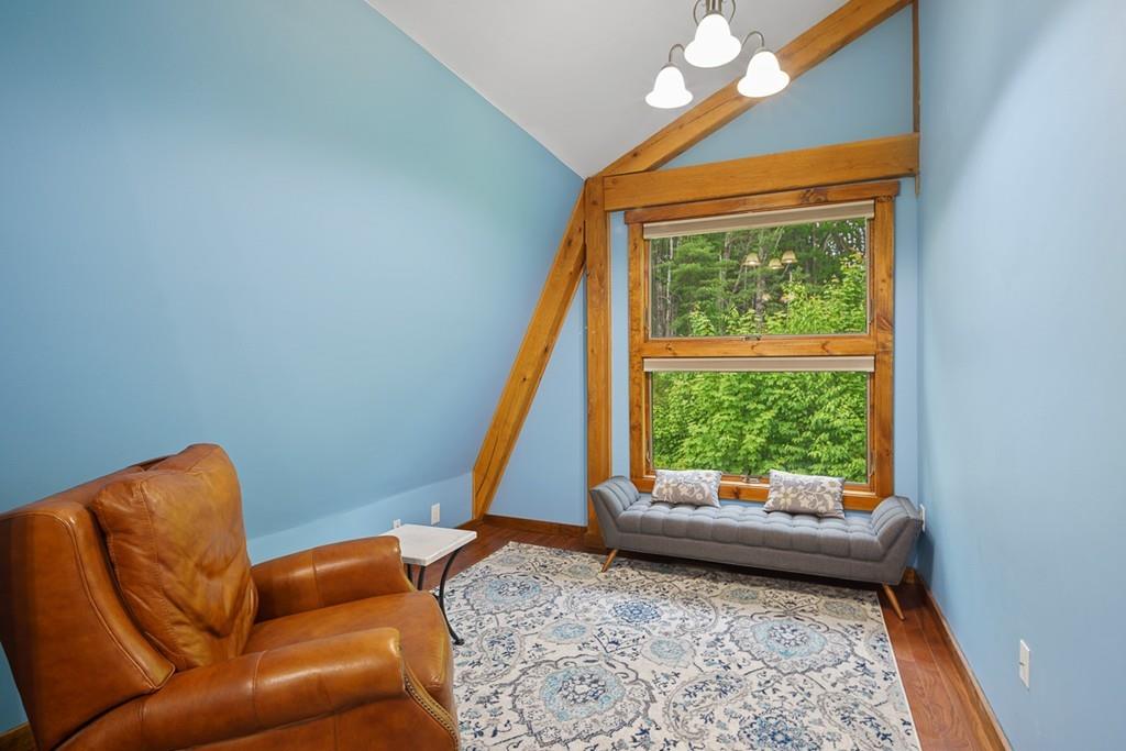 49 Beaman Road Princeton, MA 01541 - Photo 29 of 42 a living room with a couch and a window