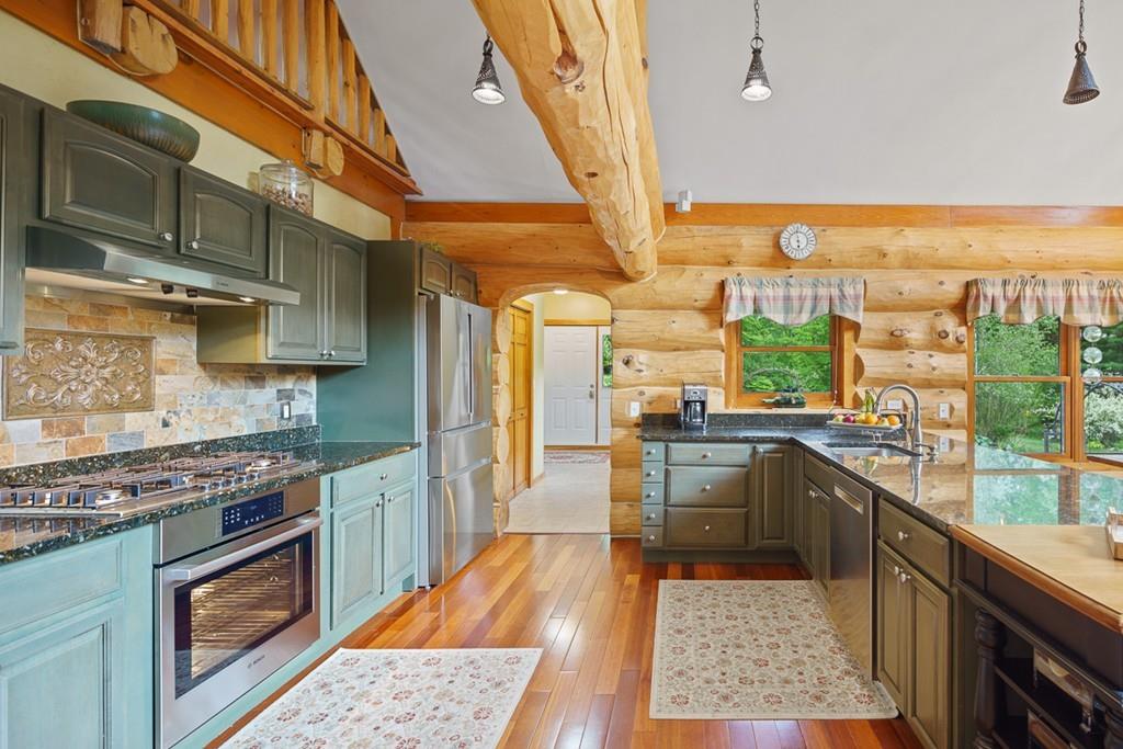 49 Beaman Road Princeton, MA 01541 - Photo 8 of 42 a kitchen with lots of counter top space and wooden floor