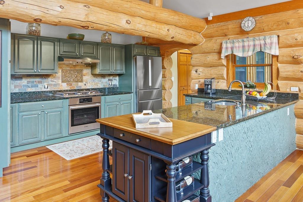 49 Beaman Road Princeton, MA 01541 - Photo 9 of 42 a kitchen with stainless steel appliances granite countertop a stove a sink and a refrigerator