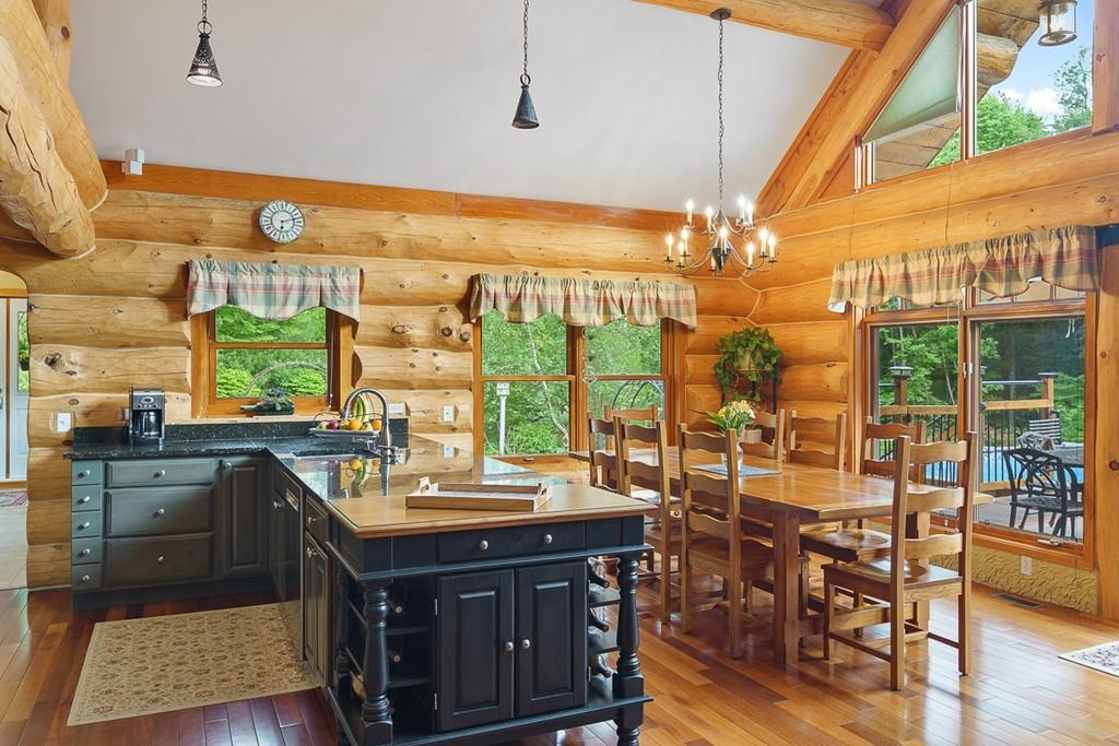 49 Beaman Road Princeton, MA 01541 - Photo 10 of 42 a room with lots of wooden furniture and large windows