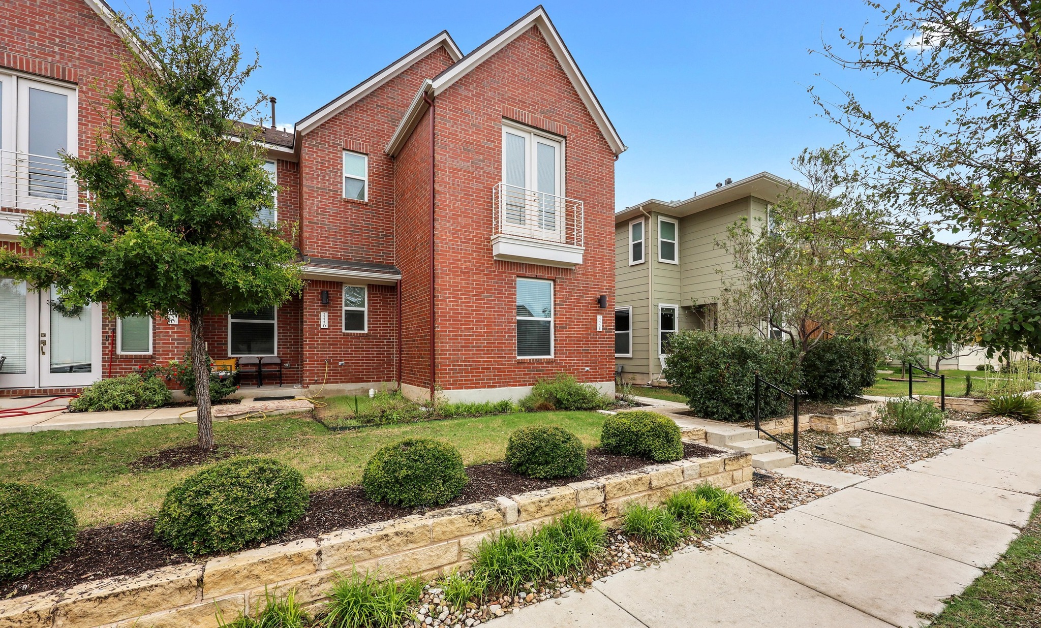 2222 Simond Avenue, Unit E Austin, TX 78723 - Photo 1 of 28 Traditional red brick facade for this building is very welcoming.