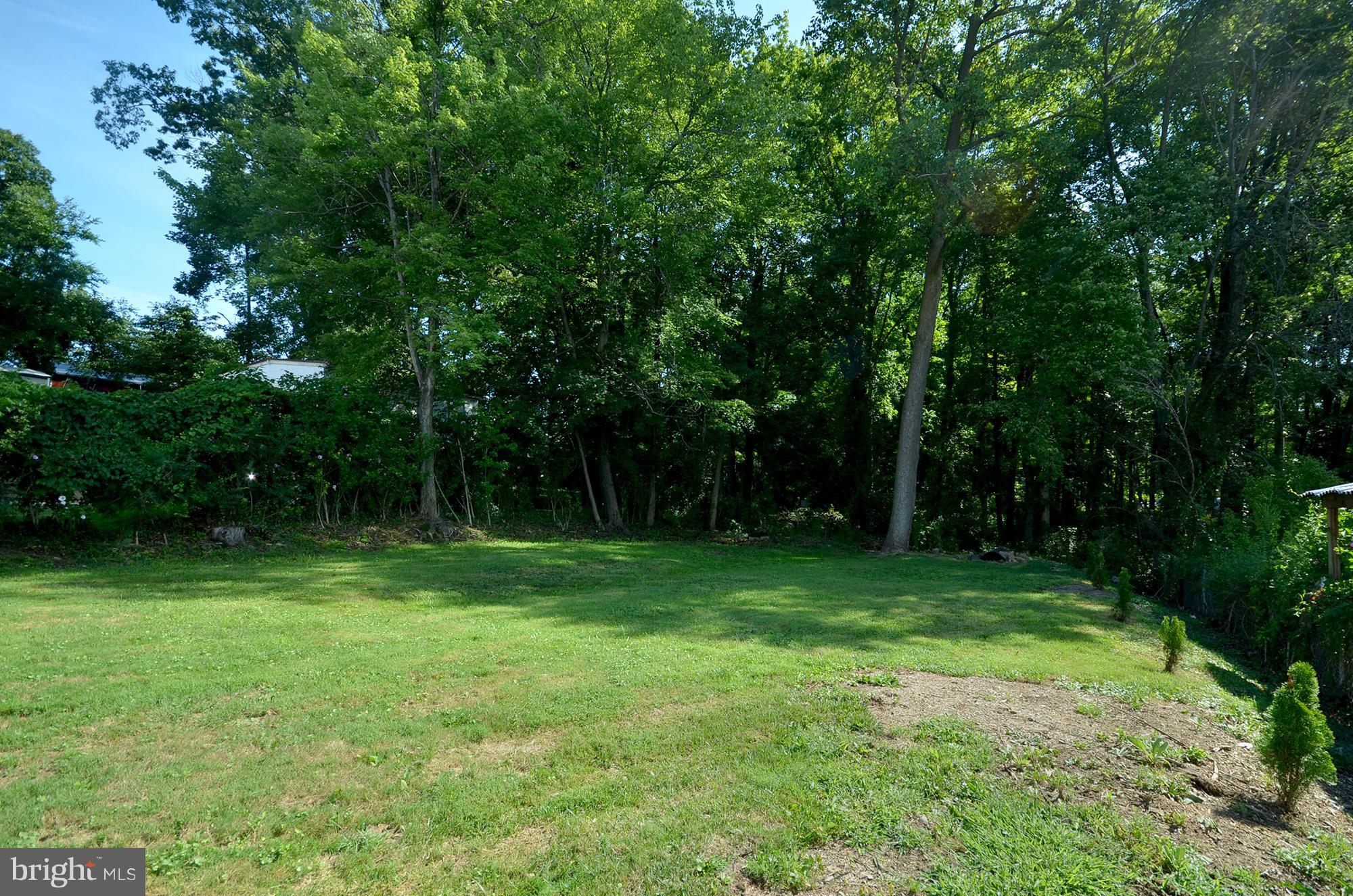 8709 Littlewood Road Baltimore, MD 21234 - Photo 18 of 19 SPACIOUS LEVEL YARD BACKS TO TREES