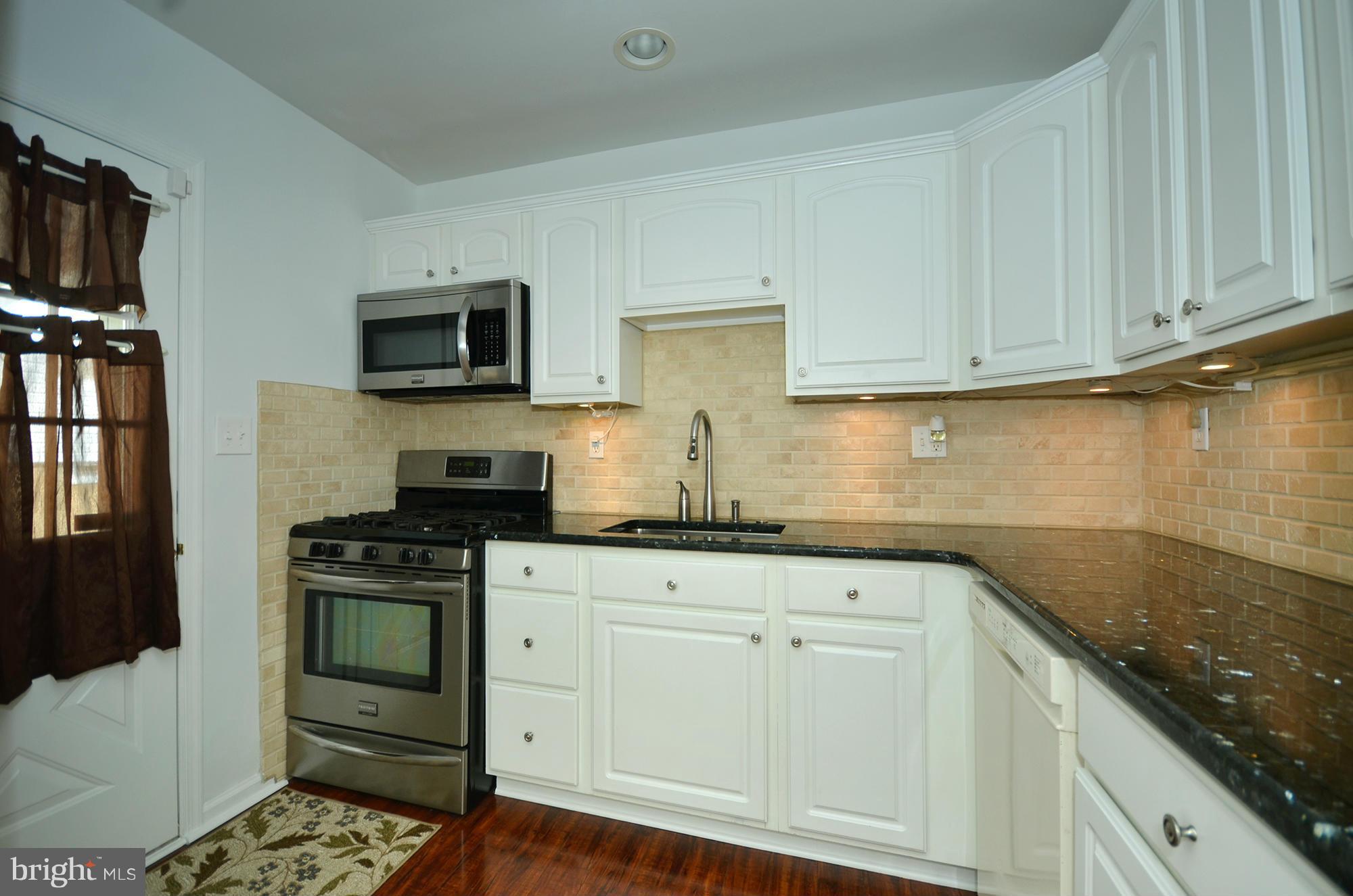 8709 Littlewood Road Baltimore, MD 21234 - Photo 7 of 19 KITCHEN W/SIDE DOOR TO EXTERIOR