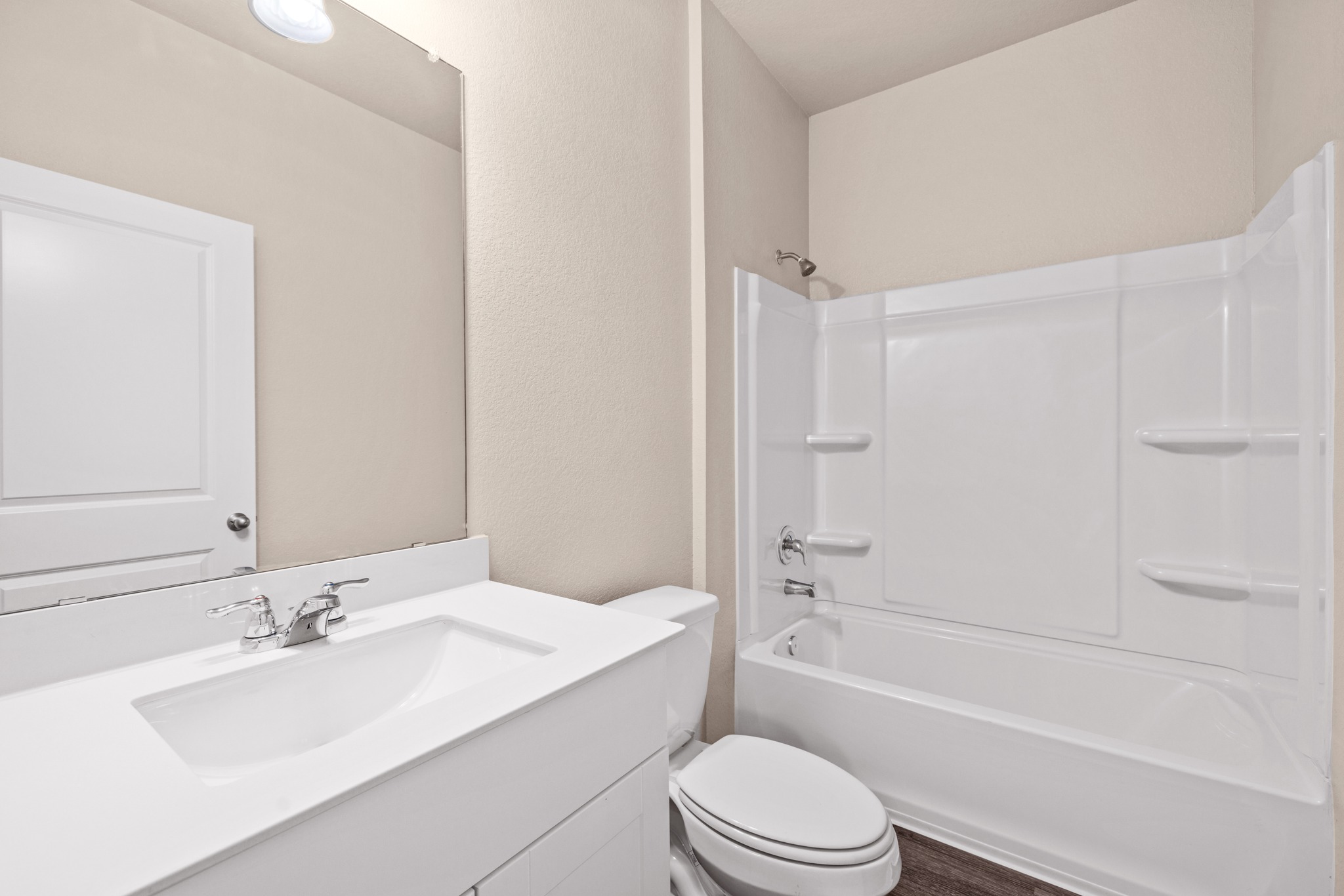 241 Night Riders Way Jarrell, TX 76537 - Photo 15 of 39 Full bathroom featuring vanity, a textured wall, and shower / washtub combination