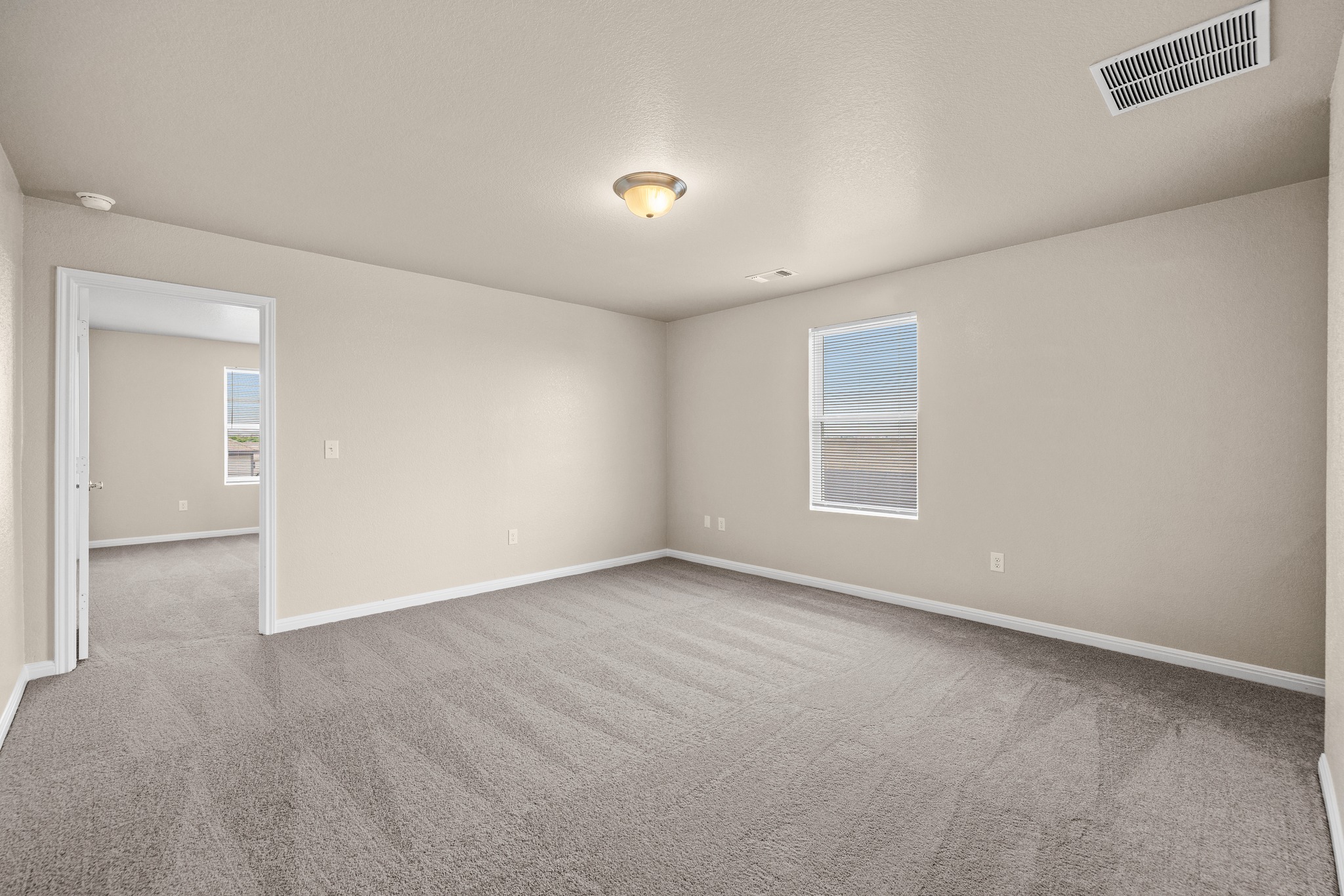 241 Night Riders Way Jarrell, TX 76537 - Photo 17 of 39 Empty room featuring light carpet and baseboards
