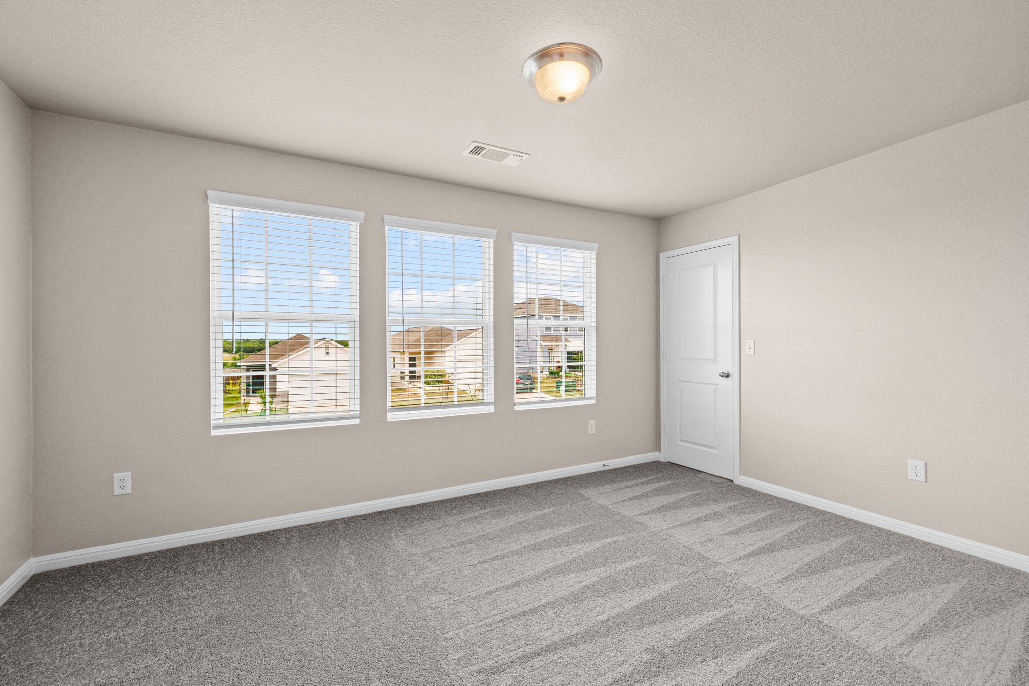 241 Night Riders Way Jarrell, TX 76537 - Photo 23 of 39 Empty room featuring light carpet