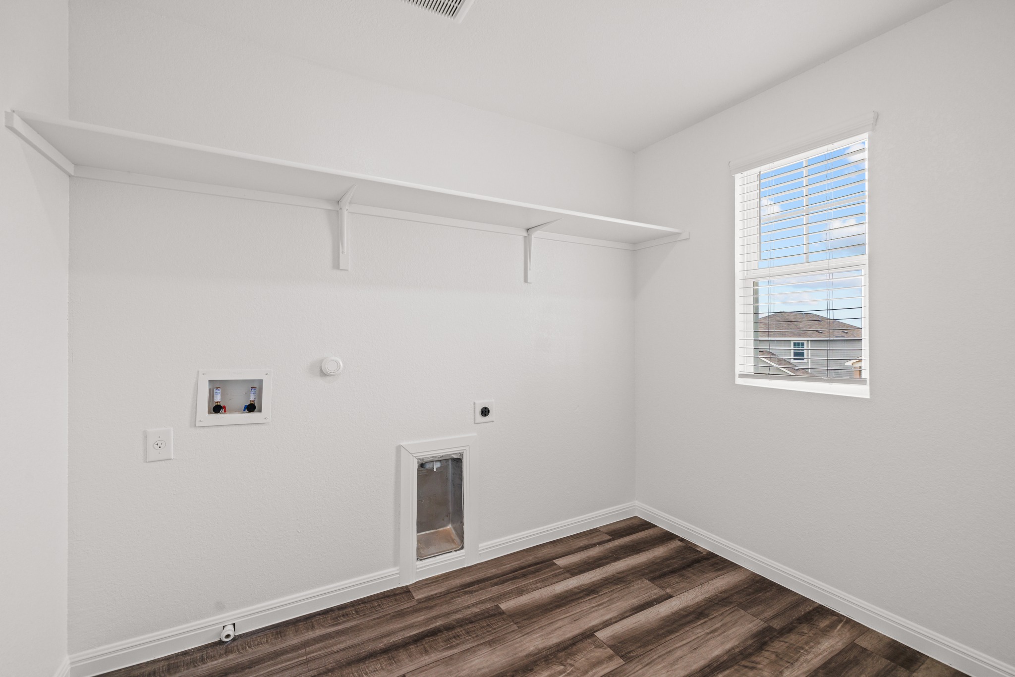 241 Night Riders Way Jarrell, TX 76537 - Photo 25 of 39 Laundry room featuring gas dryer hookup, dark wood finished floors, washer hookup, and electric dryer hookup