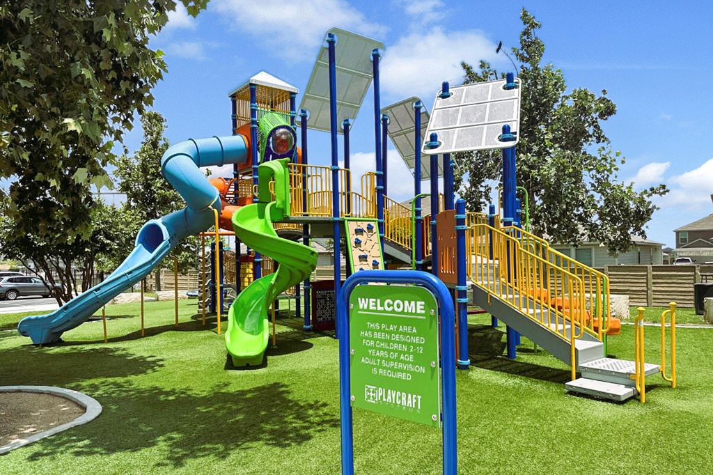 241 Night Riders Way Jarrell, TX 76537 - Photo 38 of 39 Communal playground with a lawn