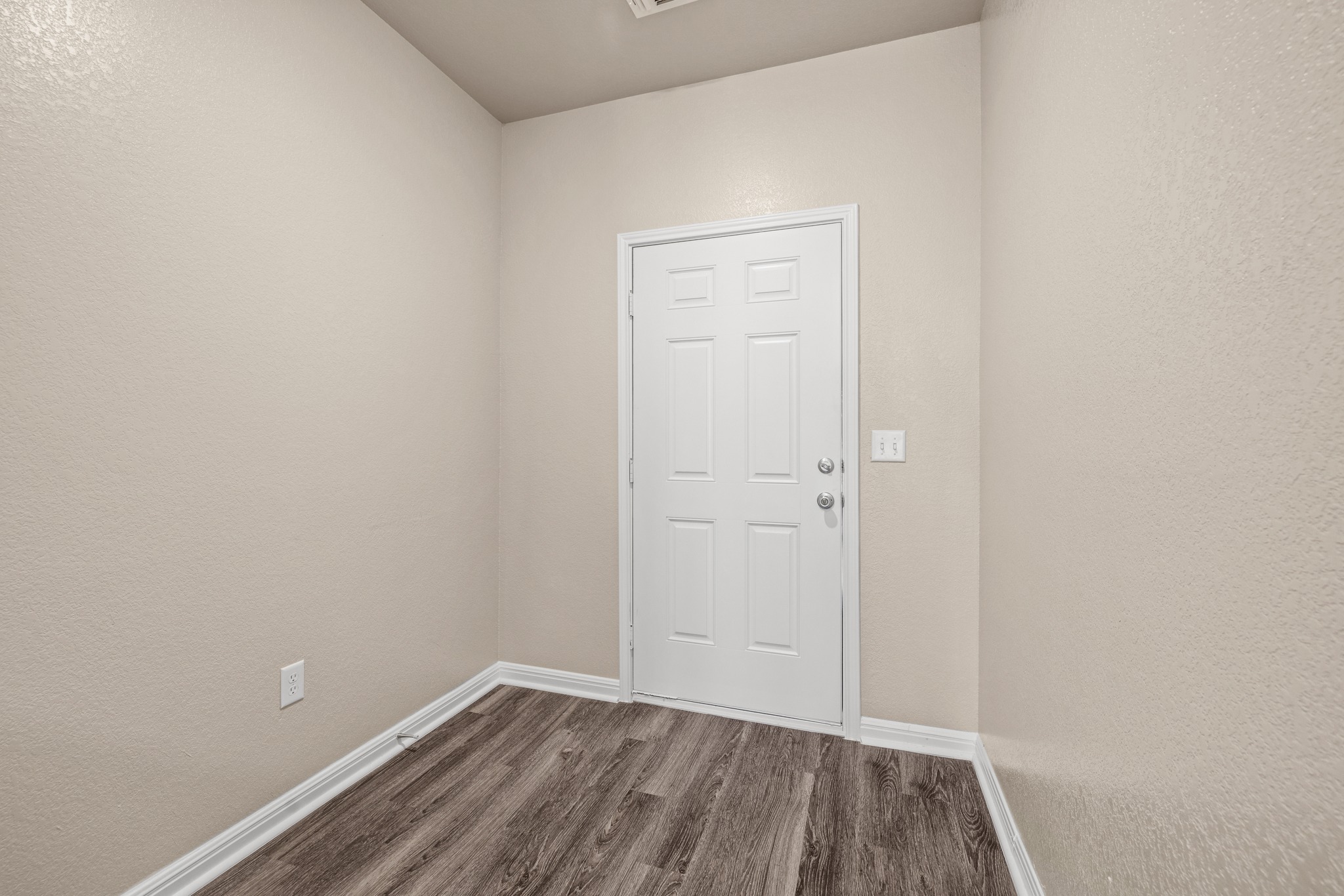 241 Night Riders Way Jarrell, TX 76537 - Photo 5 of 39 Entryway with a textured wall and wood finished floors