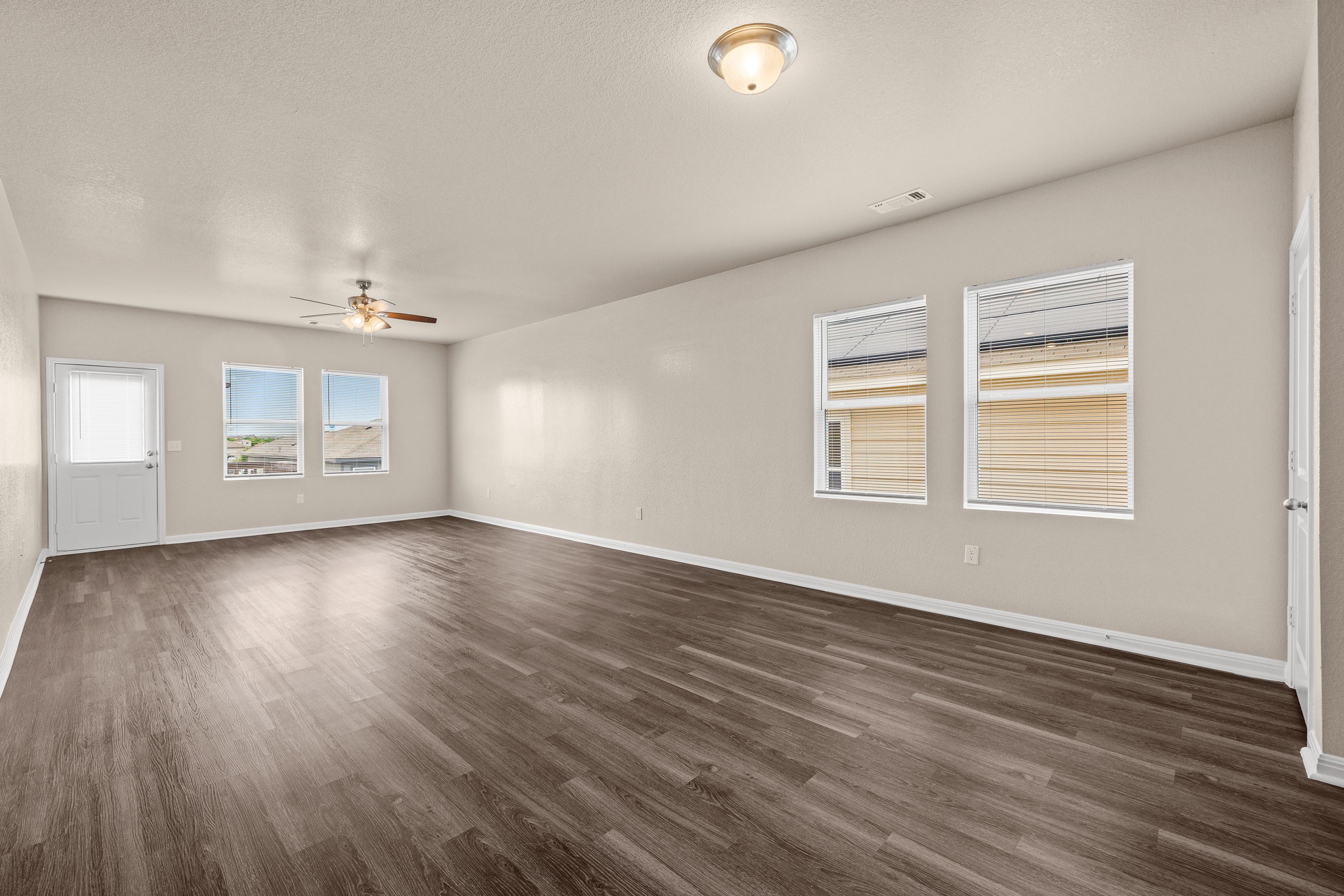241 Night Riders Way Jarrell, TX 76537 - Photo 7 of 39 Spare room featuring dark wood-style flooring and ceiling fan