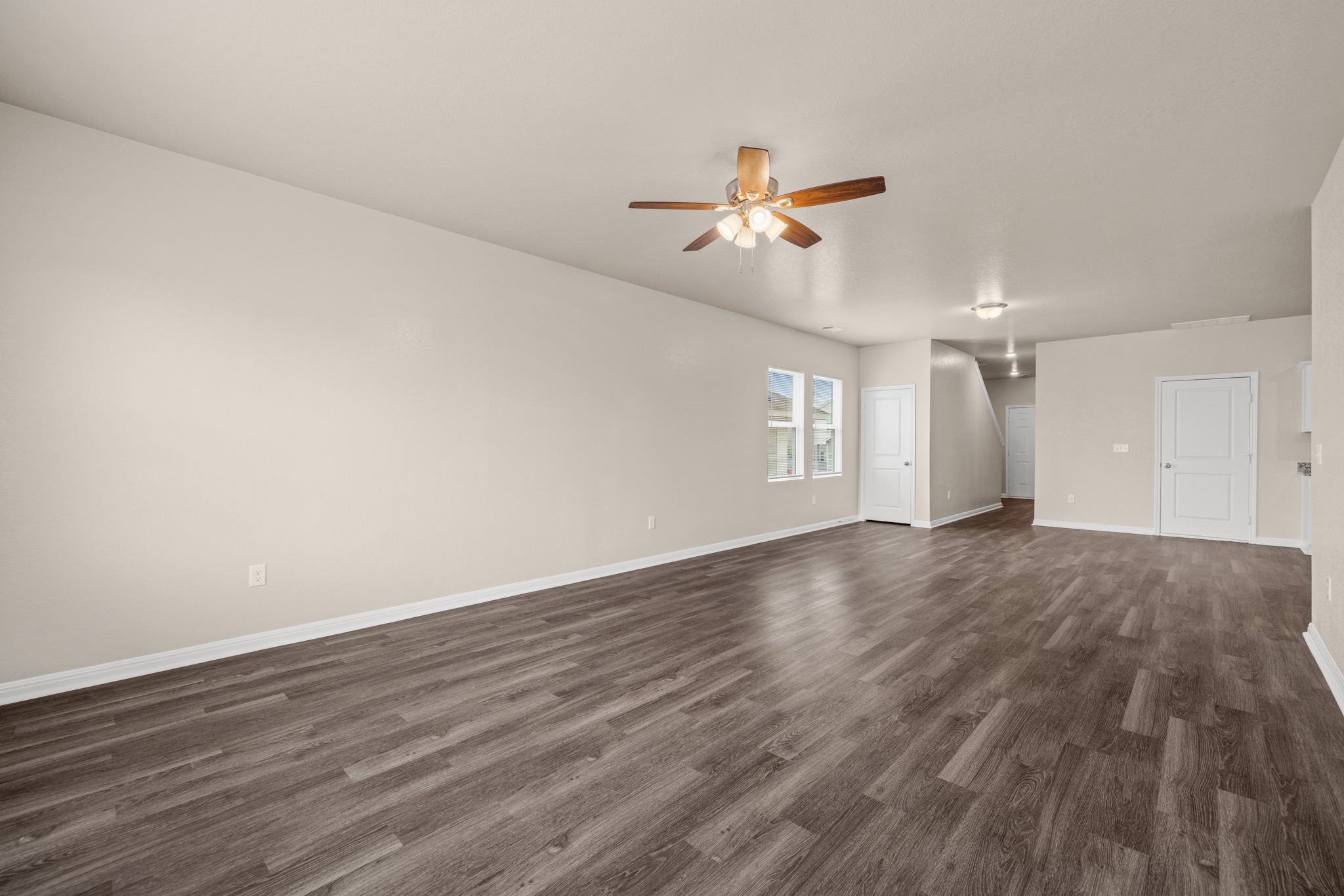 241 Night Riders Way Jarrell, TX 76537 - Photo 8 of 39 Unfurnished room featuring dark wood finished floors and a ceiling fan